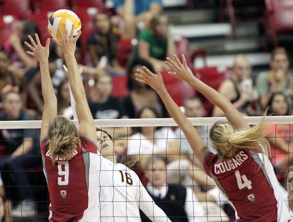 COUGARS ROAR: ASU sophomore hitter Danica Mendivil (16) attempts a spike while WSU senior Meagan Ganzer (9) and redshirt freshman Stephanie Hagins (4) move to block. The Cougars came back to win after falling behind two sets to none. (Photo by Rosie Gochnour)