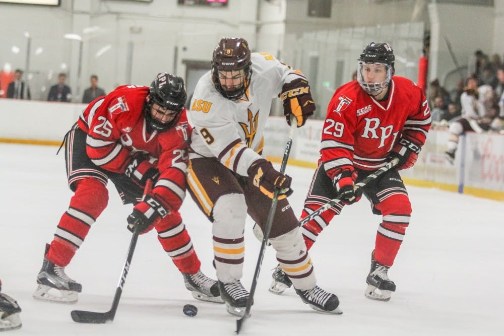 Graduate Student Robbie Baillargeon (9) works his way to the goal at the ASU versus RPI Men's Hockey game in Tempe, Arizona, on November 26. 2016.