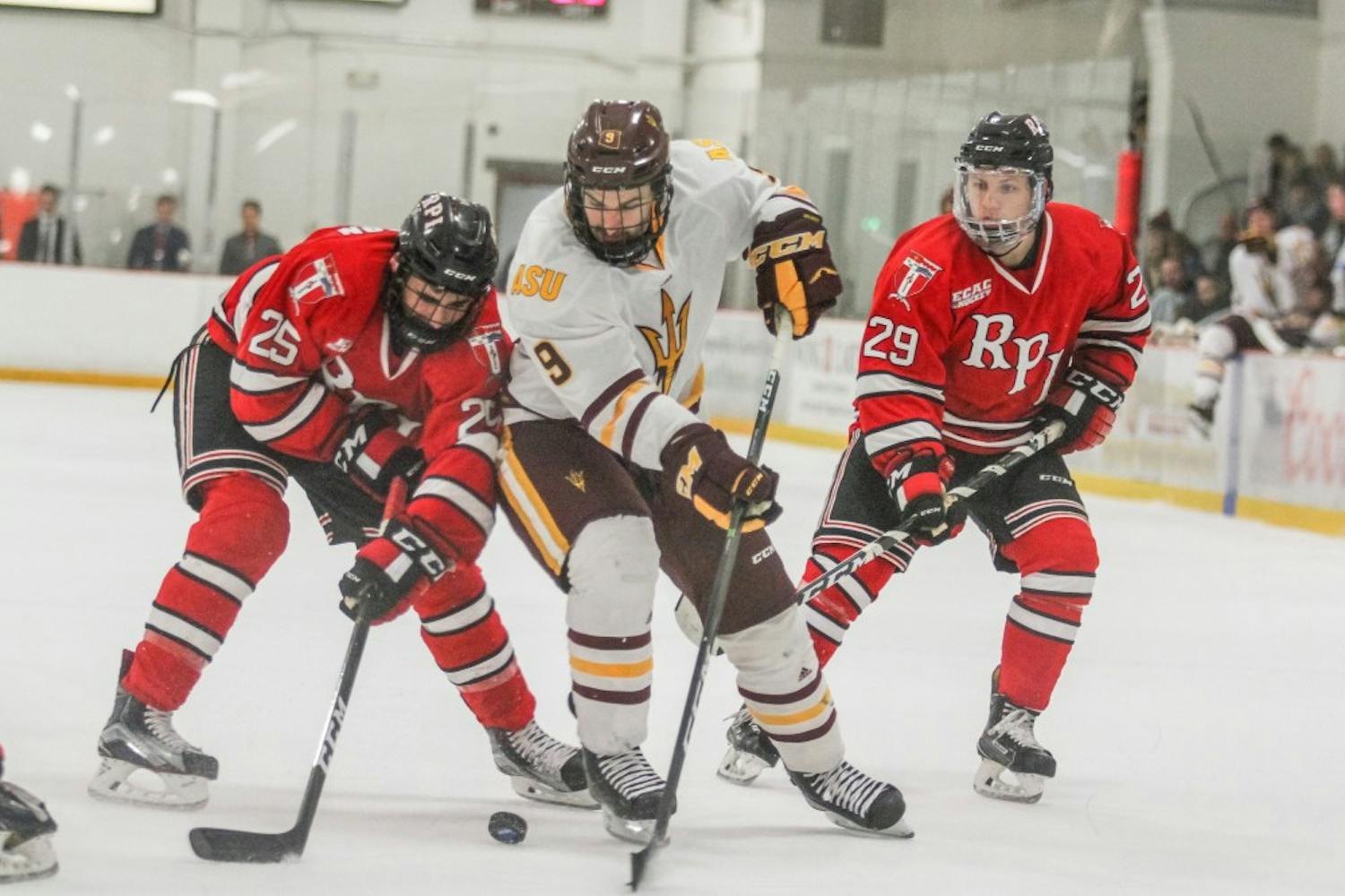 Graduate Student Robbie Baillargeon (9) works his way to the goal at the ASU versus RPI Men's Hockey game in Tempe, Arizona, on November 26. 2016.