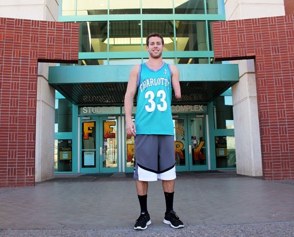 Junior Max Okun smiles outside of the Student Recreation Center on Tuesday. Born with only one arm, Okun played basketball in high school and continues to play at the SRC frequently. (Photo by Marissa Krings)