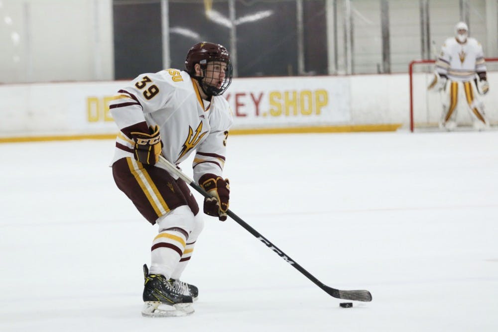 Freshman Brinson Pasichnuk (39) looks to pass the puck in the game against Simon Fraser at the Oceanside Ice Arena in Tempe, Arizona on Saturday, Feb. 11, 2017. 