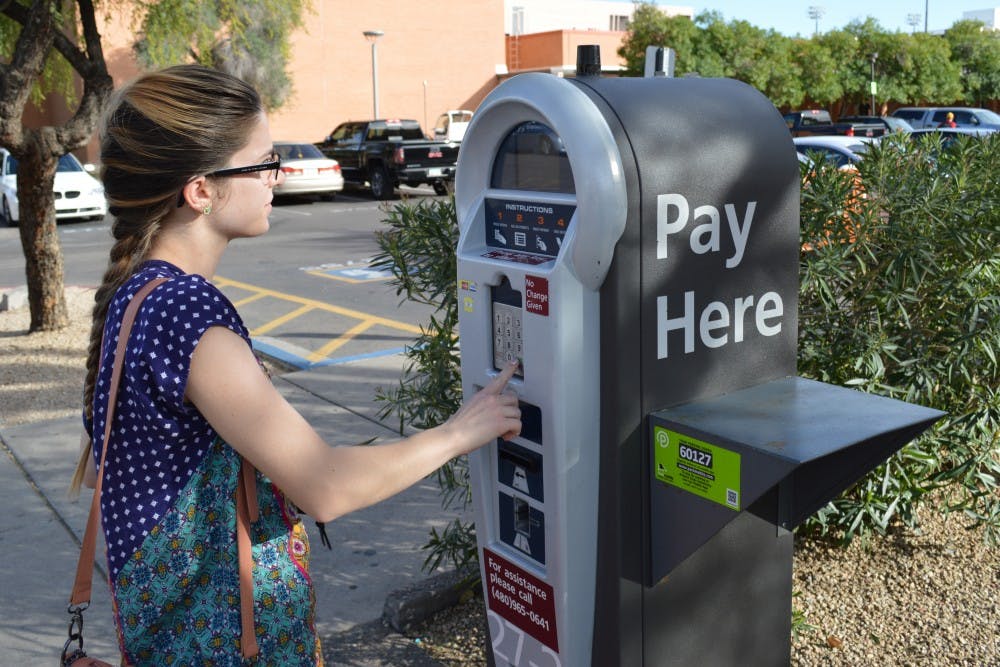 ASU student, Maya Wats, paying for parking at Tempe ASU campus o