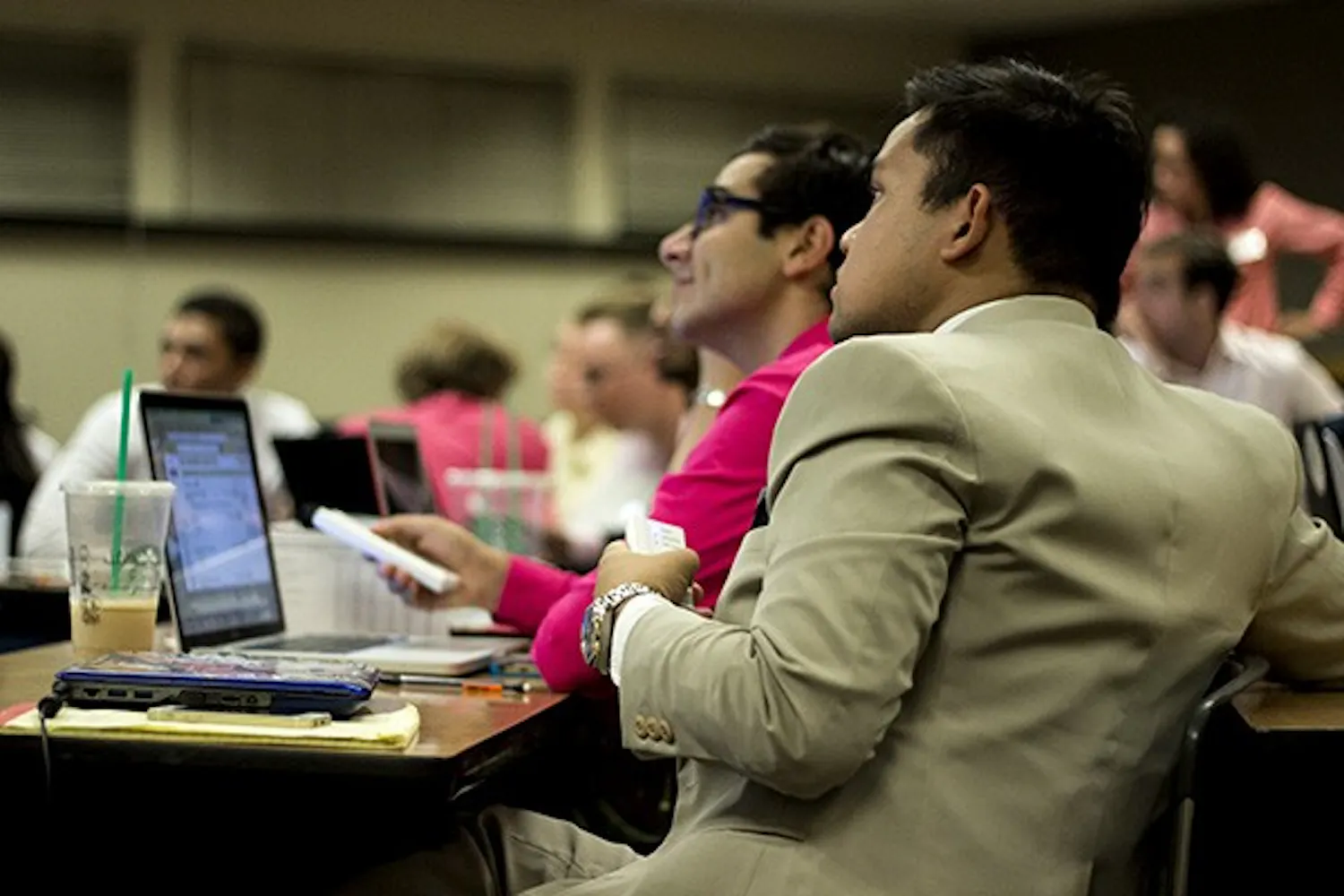Senator John Oyas uses his clicker to vote for a bill at a USG meeting on Oct. 7, 2014. (Photo by Alexis Macklin)