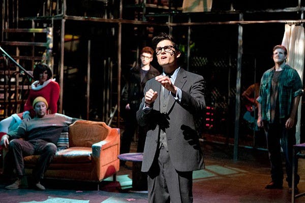 (Left) Tyler J Gasper (Angel), Devin Barad (Collins) and Philip Morgan (Roger), listen to Jesse Thomas Foster (Benny)'s business plan for a new art studio at a dress rehearsal of “Rent”. (Photo by Mario Mendez)
