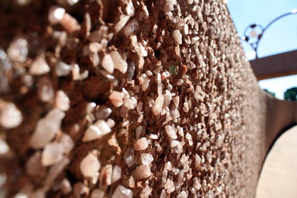 The rock wall along ASU Gammage on the Tempe campus glistens in the afternoon sun on Tuesday. (Photo by Jessie Wardarski)