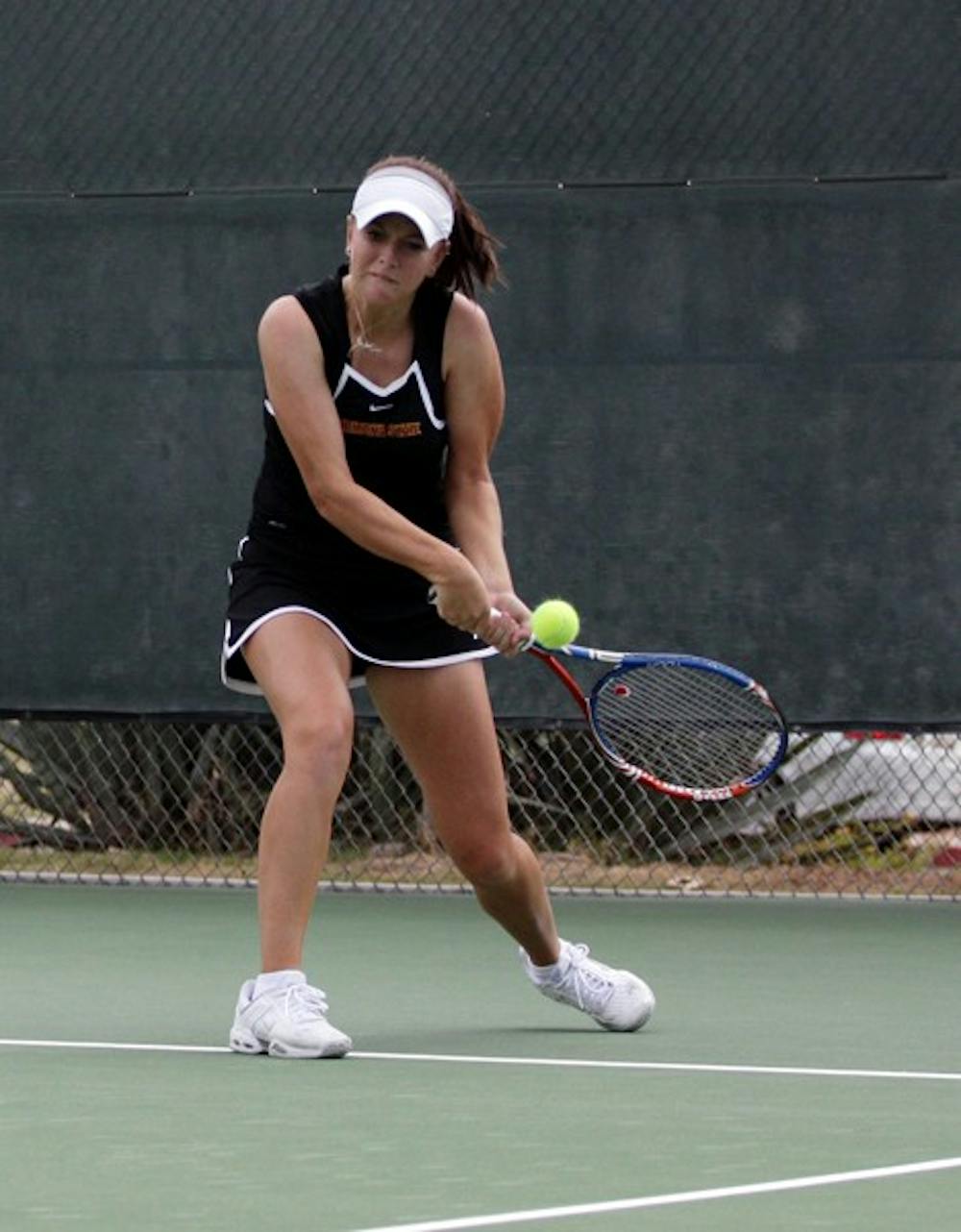 Joanna Smith hits a backhand during the ASU Thunderbird Invitational on Nov. 4, 2011. Smith was one of many Sun Devils to win matches over UC Davis and UC Santa Barbara last weekend. (Photo by Nathan Meacham)