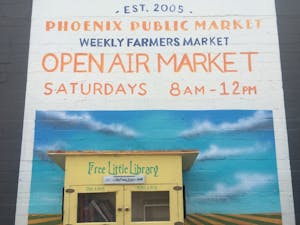 A painting on the side of the Phoenix Public Market advertises the weekly Open Air Market.
