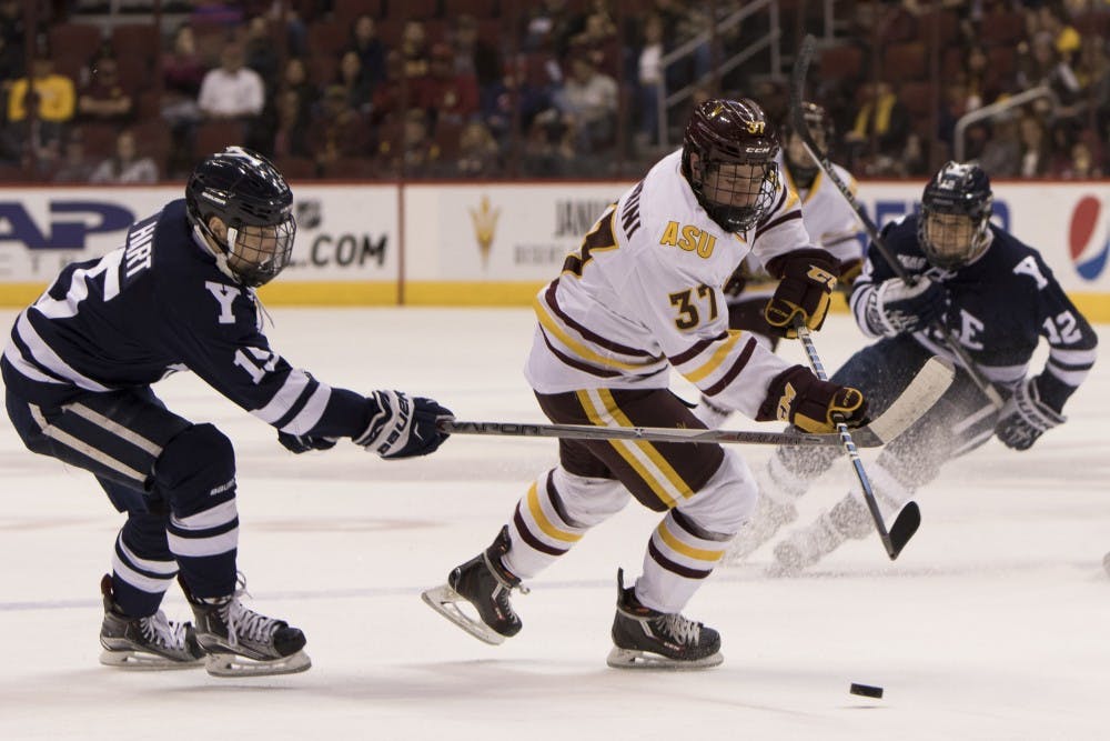 Freshman forward Charlie Zuccarini (37) dekes a Yale defender in the first period against Yale on Friday, Jan. 8, 2016, at Gila River Arena in Glendale. The Bulldogs defeated the Sun Devils 4-0. 