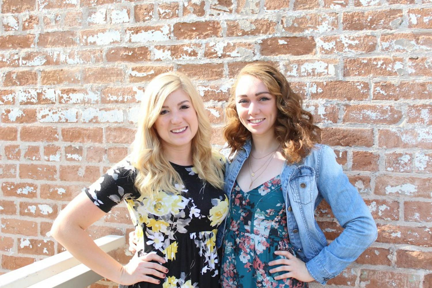 Samantha Calvin (left) and Kaitlyn Felix (right) pose for a photo outside of DeSoto Central Market&nbsp;on Tuesday, June 20, 2017.