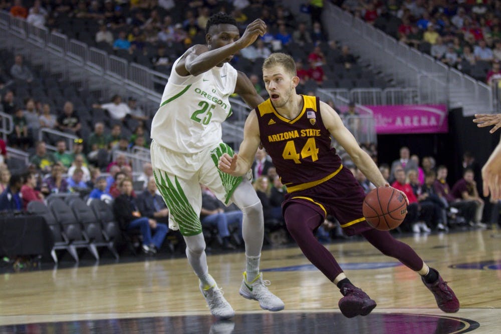ASU junior guard Kodi Justice (44) tries to drive past Oregon forward Chris Boucher (25) during the first half of a quarter-final PAC-12 Tournament matchup versus the Oregon Ducks in T-Mobile Arena in Las Vegas, Nevada on Thursday, March 9, 2017. ASU lost 80-57.