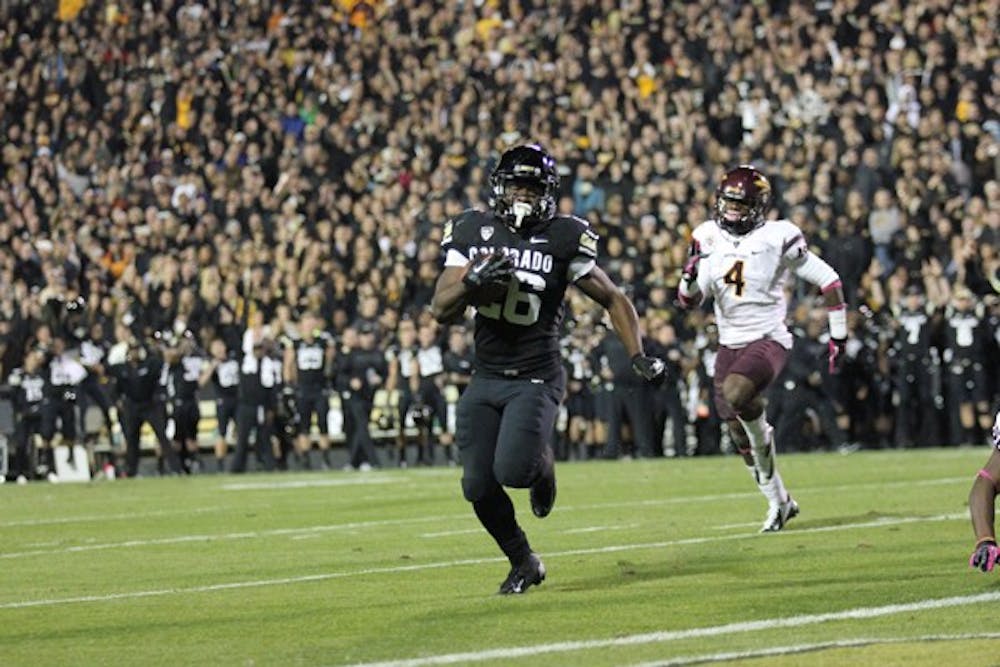 Colorado sophomore running back Tony Jones (26) beats ASU junior safety Alden Darby (4) to the corner for a touchdown, giving Colorado a 7-6 lead in the second quarter. (Photo by Kyle Newman)