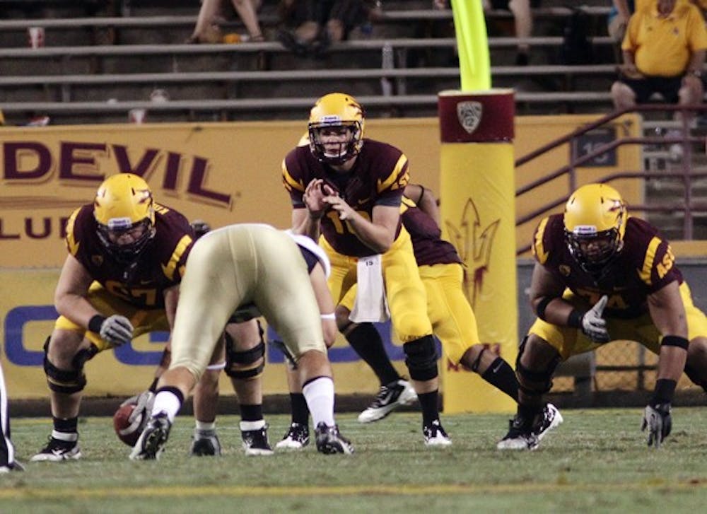 READY: Freshman backup quarterback Taylor Kelly prepares to call a snap during the fourth quarter of the Sun Devils’ 48-14 win over UC Davis on Sept. 1. Kelly and redshirt freshman quarterback Mike Bercovici remain vital to the team despite being behind junior starter Brock Osweiler on the depth chart. (Photo by Beth Easterbrook)