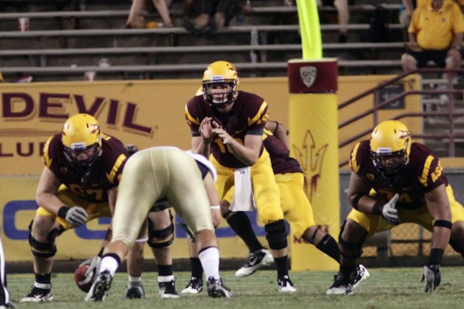 READY: Freshman backup quarterback Taylor Kelly prepares to call a snap during the fourth quarter of the Sun Devils’ 48-14 win over UC Davis on Sept. 1. Kelly and redshirt freshman quarterback Mike Bercovici remain vital to the team despite being behind junior starter Brock Osweiler on the depth chart. (Photo by Beth Easterbrook)