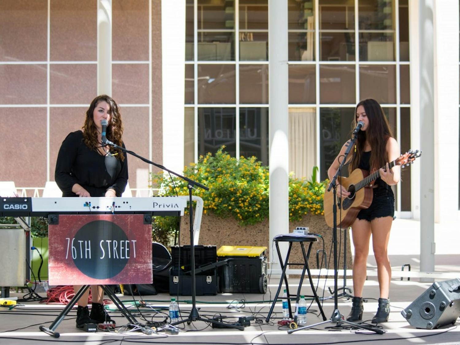 The band 76th Street is made up of junior Haley Gold, left, a communication and film major, on piano and vocals, and junior Spencer Bryant, a business communications major, on guitar and vocals.  The Express Yourself performance series is held every Monday from 11:30 a.m. to 1 p.m. on the Memorial Union North Stage in Tempe. The series invites Arizona State University students to showcase their talents through various art forms. 