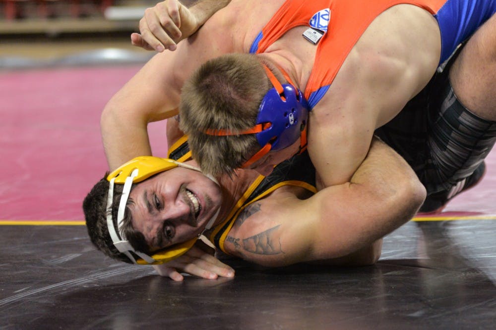 Sun Devil Senior Josh DaSilveira and  Chili Sabin from Boise State wrestle in a match on Sunday, Nov. 21, 2015, at the Wells Fargo  Arena in Tempe.