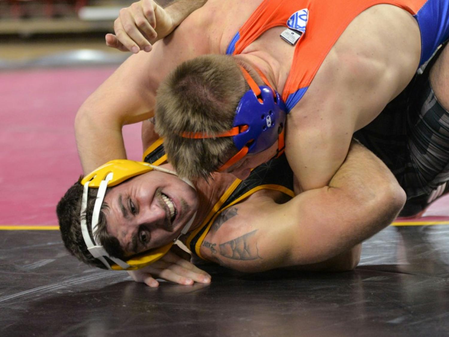 Sun Devil Senior Josh DaSilveira and  Chili Sabin from Boise State wrestle in a match on Sunday, Nov. 21, 2015, at the Wells Fargo  Arena in Tempe.
