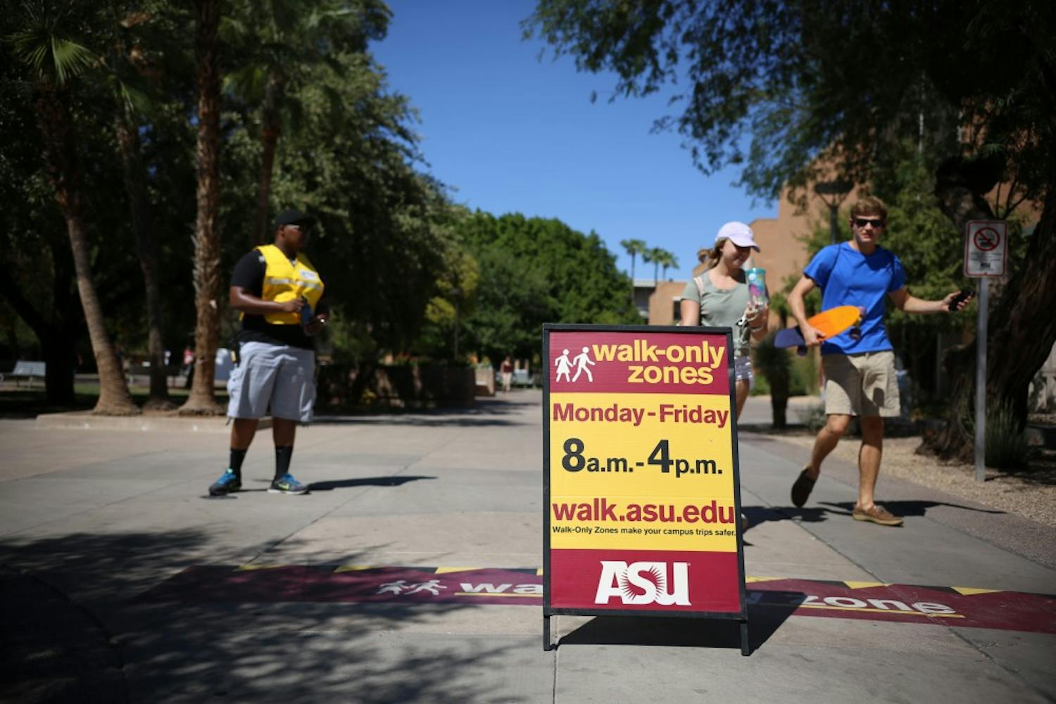 Passing students respecting the walk-only zones on Saturday, Sep. 16, 2016, on the ASU campus in Tempe, Arizona.