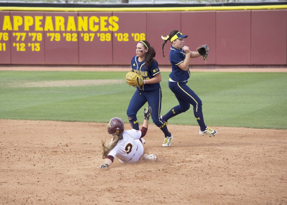 ASU freshman Brynley Steele attempts to take second base against Michigan junior Sierra Romero, Sunday March 1, 2015, at Farrington Stadium in Tempe. The Sun Devils lost to the Wolverines 6-2. (Krista Tillman/The State Press)