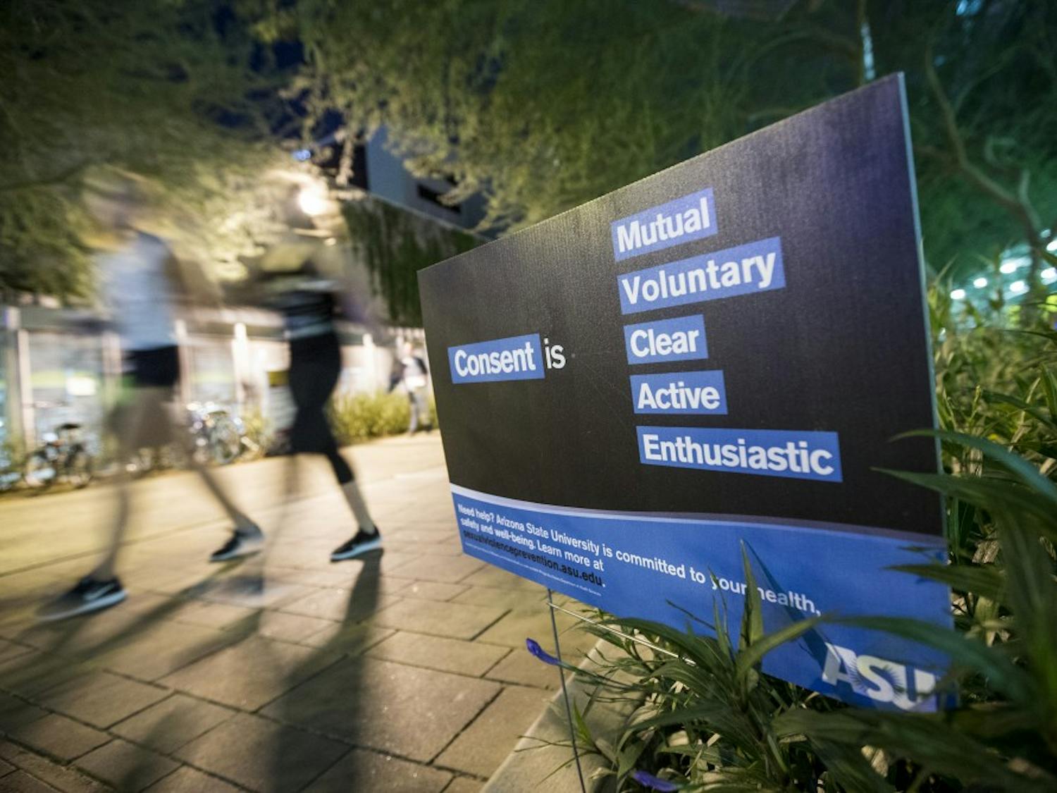 Students walk by an ASU consent sign on Taylor Mall in Downtown Phoenix on Monday, Sept. 26, 2016.