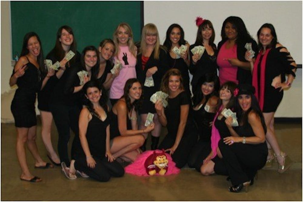 The show’s cast with some of the money they raised for Kaity’s Way and the Women of Haiti. Photo courtesy of Cindy Pruett.  