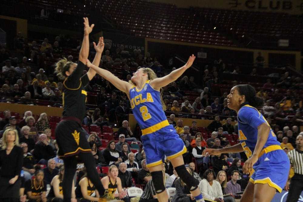Redshirt senior Katie Hempen makes a two-point shot over UCLA's Kari Korver on Friday, Feb. 5, 2016, at Wells Fargo Arena in Tempe. Hempen later broke the ASU record for career three-pointers.