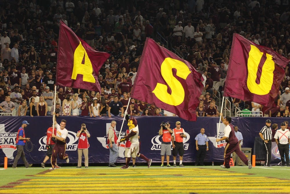 ASU football's spirit squad and Sparky run across the field after the Sun Devils converted a field goal in their game against Texas A&amp;M at NRG Stadium in Houston on Sept. 5, 2015. ASU lost 38-17.