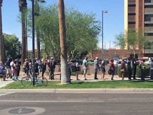 Voters line up outside the Salvation Army Citadel on Third Avenue and Fillmore Street on Tuesday, March 23, 2016, in Phoenix.