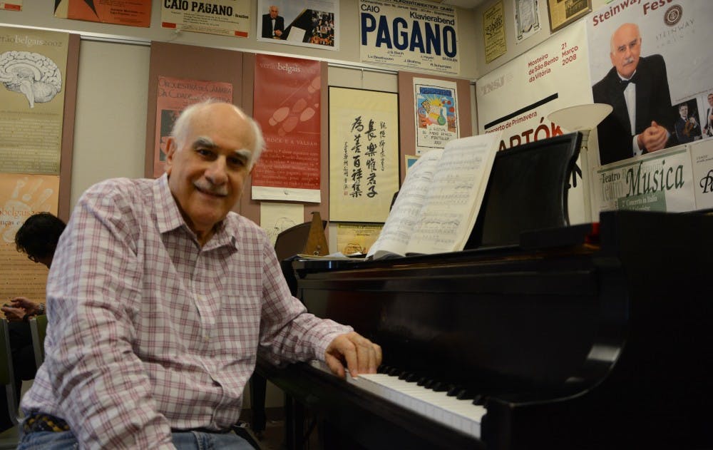 Music professor Caio Pagano poses for a portrait in his office on&nbsp;Monday, March 16, 2015. Pagano is a co-creator&nbsp;The Avanti Fund, which will host the&nbsp;Avanti Chamber Music Festival this weekend.&nbsp;