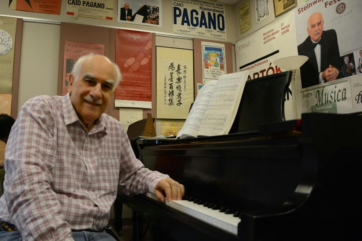 Music professor Caio Pagano poses for a portrait in his office on&nbsp;Monday, March 16, 2015. Pagano is a co-creator&nbsp;The Avanti Fund, which will host the&nbsp;Avanti Chamber Music Festival this weekend.&nbsp;
