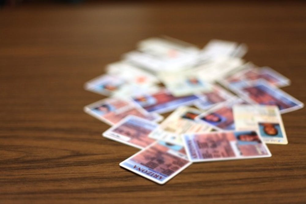 Bouncers and bartenders from the Mill Avenue District confiscated more than 2,000 fake IDs in 2011. (Photo by Beth Easterbrook)