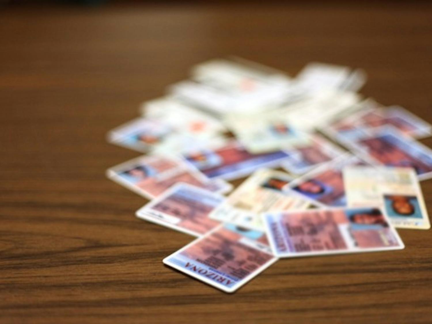 Bouncers and bartenders from the Mill Avenue District confiscated more than 2,000 fake IDs in 2011. (Photo by Beth Easterbrook)