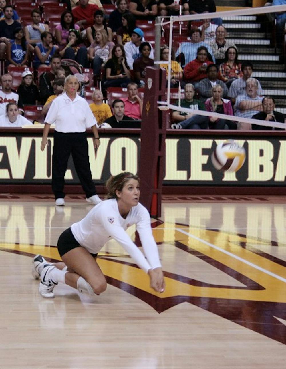 FIGHTING THE LOWS: Redshirt sophomore outside hitter Ashley Kastl digs for the ball during the Sun Devils’ 3-0 loss to No. 2 UCLA on Friday. Kastl contributed a match-best in kills with 23 against No. 5 USC despite the tough loss. (Photo by Michaela Mader)