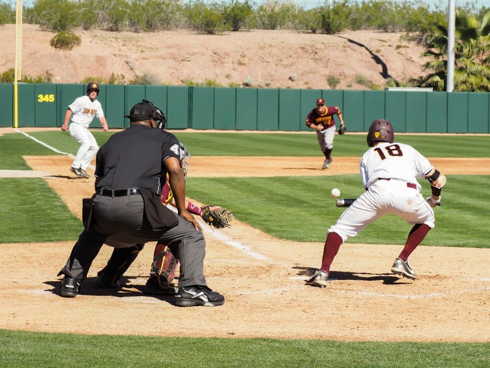 Junior Sun Devil outfielder Johnny Sewald bunts, batting in a run, during Saturday's intrasquad scrimmage on Feb. 7, 2015, at Phoenix Municipal Stadium. (J. Bauer-Leffler/ The State Press)