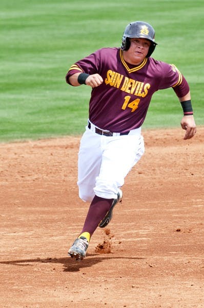 Freshman catcher RJ Ybarra runs second looking to beat the throw to third during an April 7 game against Oregon. The freshman’s incredible performances the last five games earned him Pac-12 Player of the Week honors. (Photo by Molly J. Smith)
