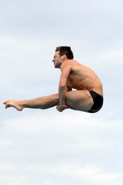 Title hopes: ASU junior Constantin Blaha tucks mid-dive during the Sun Devils’ loss to Cal on Jan. 21. The Austrian native is the defending conference 3-Meter springboard champion, and hopes to repeat at the Pac-10 championships in Seattle this week. (Photo by Sierra Smith)