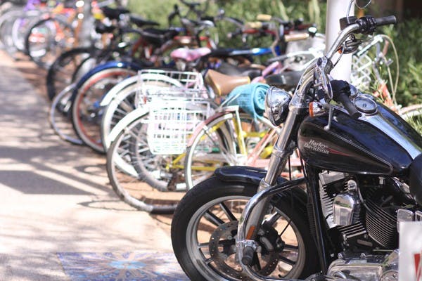 ROUGH RIDER: One of these things is not like the other. A motorcycle sits with the bicycles on the bike rack. (Photo by Lillian Reid)