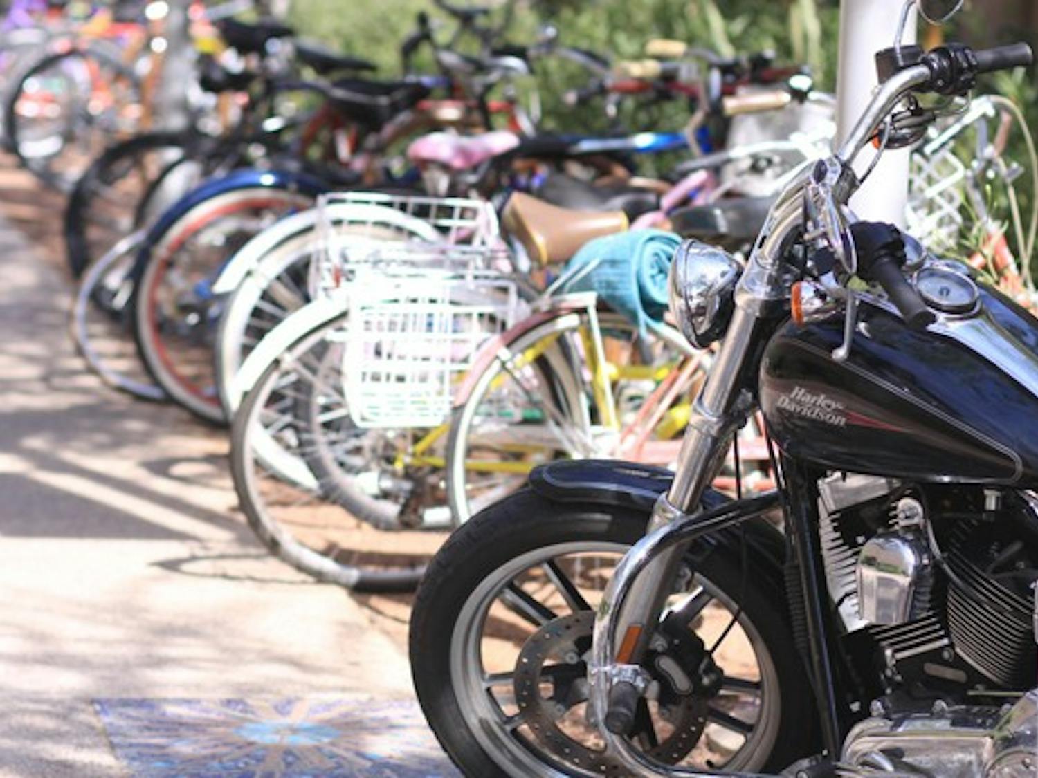 ROUGH RIDER: One of these things is not like the other. A motorcycle sits with the bicycles on the bike rack. (Photo by Lillian Reid)