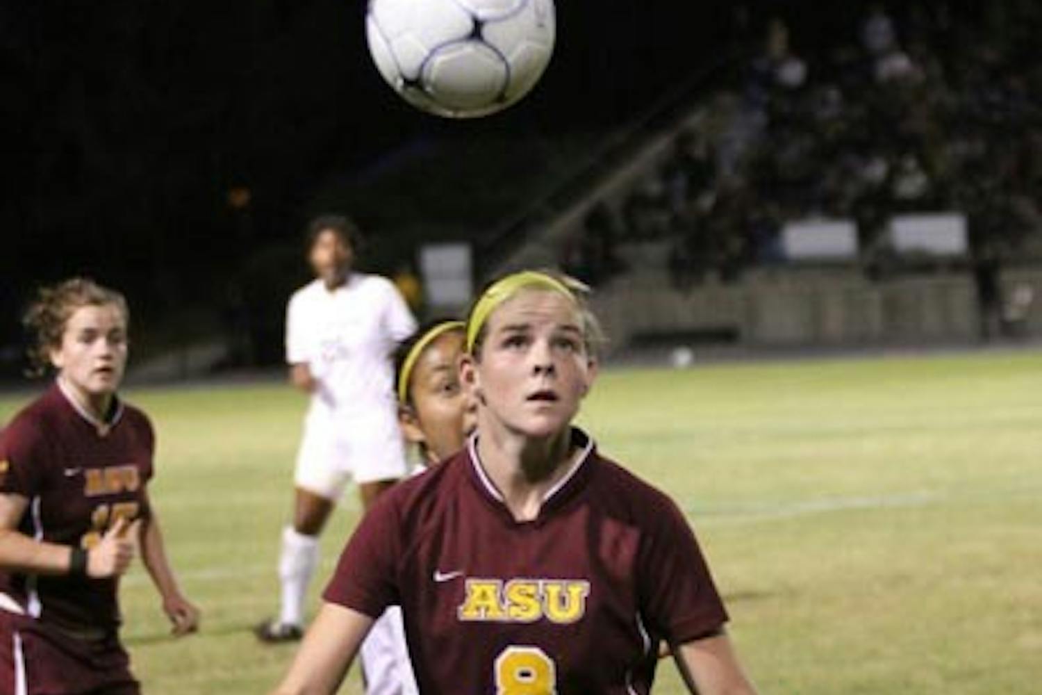 FALLING OUT: Freshman forward Devin Marshall looks to control a ball in the air Friday night against UC Irvine. Marshall scored the Sun Devils only goal in the game, and the ASU women's soccer team was eliminated from the NCAA Tournament. (Photo Courtesy of Steve Rodriguez)