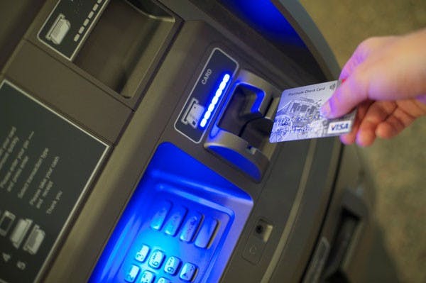 SAVING MONEY: A student’s honor's thesis shows that students are less likely to make risky decisions that affect their futures and are more concerned with financial stability than before. (Photo by Michael Arellano)