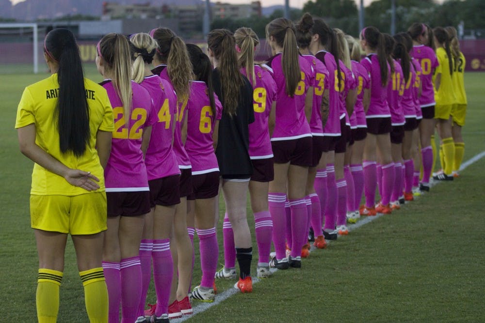 The ASU women's soccer team stands for the national anthem before a 2-0 loss to the USC Trojans in Sun Devil Soccer Stadium in Tempe, Arizona, on Saturday, Oct. 15, 2016.