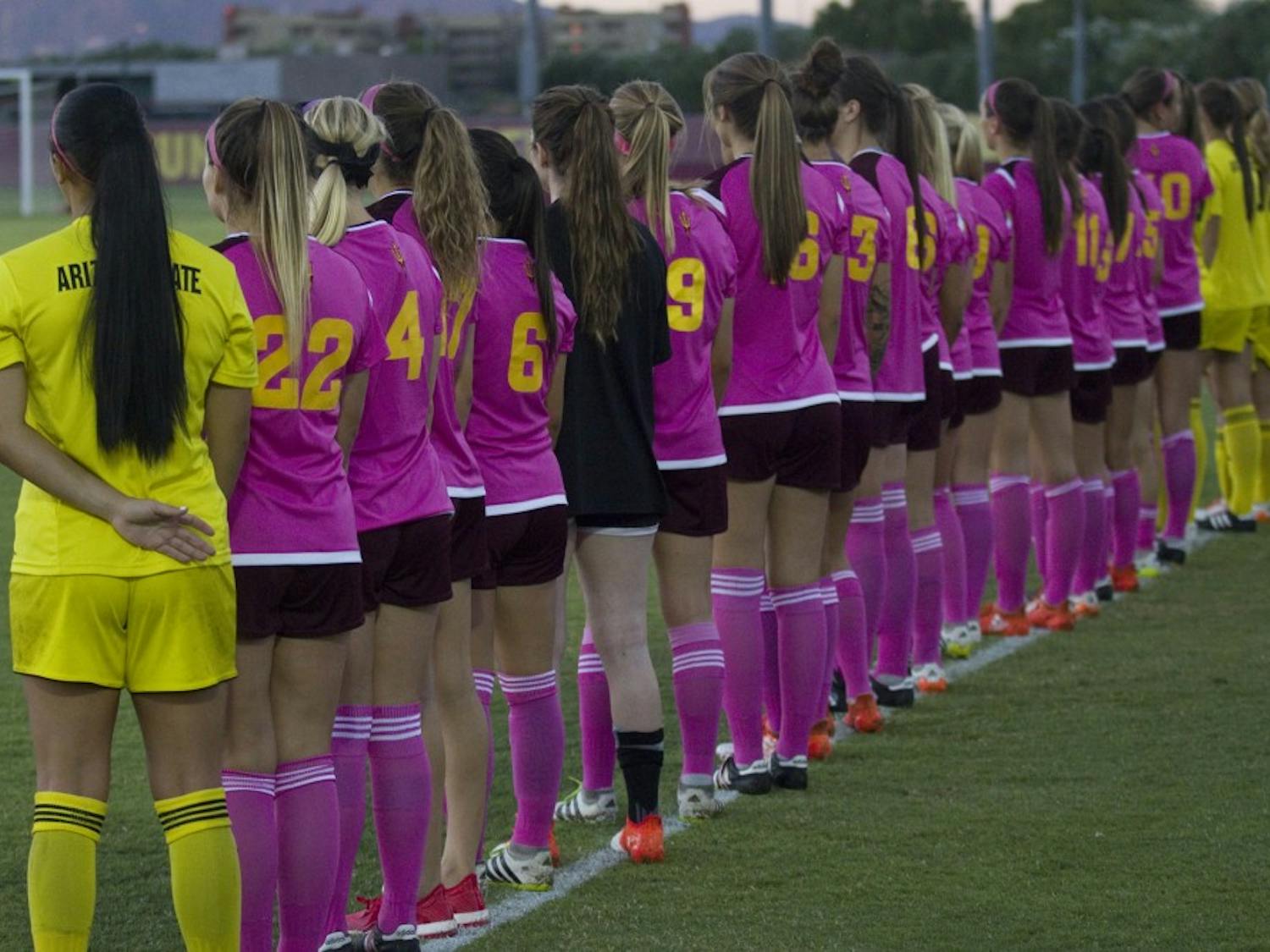 The ASU women's soccer team stands for the national anthem before a 2-0 loss to the USC Trojans in Sun Devil Soccer Stadium in Tempe, Arizona, on Saturday, Oct. 15, 2016.