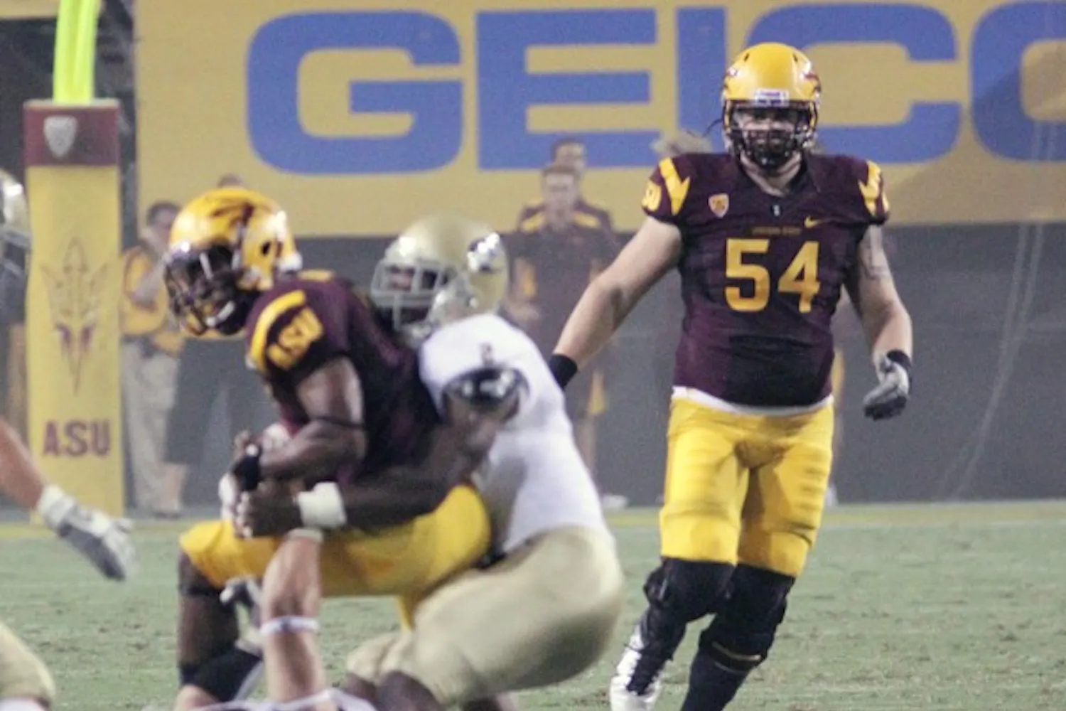 STEPPING UP: ASU redshirt freshman offensive lineman Tyler Sulka (54) follows a play during the Sun Devils’ win over UC Davis in September. With sophomore lineman Evan Finkenberg out due to injury, Sulka played against Utah on Saturday. (Photo by Beth Easterbrook)