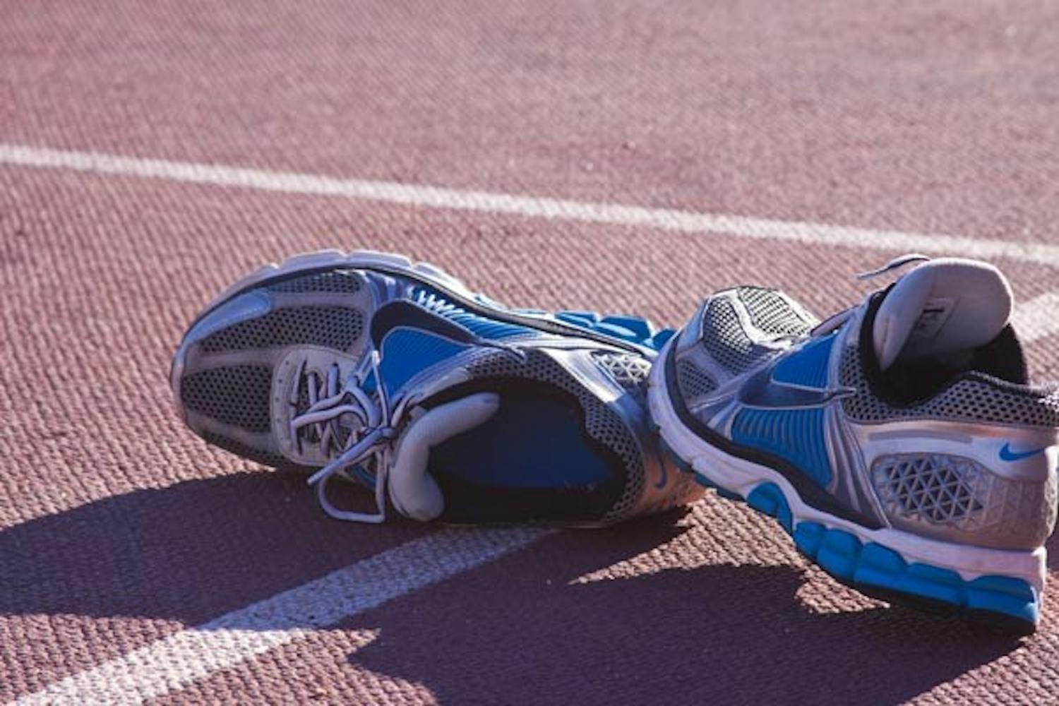 HITTIN' THE TRACK: Running shoes are left on the Sun Angel track after an early morning work-out by the Cross Country team. (Photo by Annie Wechter)
