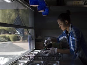 Sous Chef Myra Segura prepares a Carne Asade bowl in the Wandering Donkey's Food Truck on Thursday, Jan. 21, 2016 in Scottsdale.&nbsp;