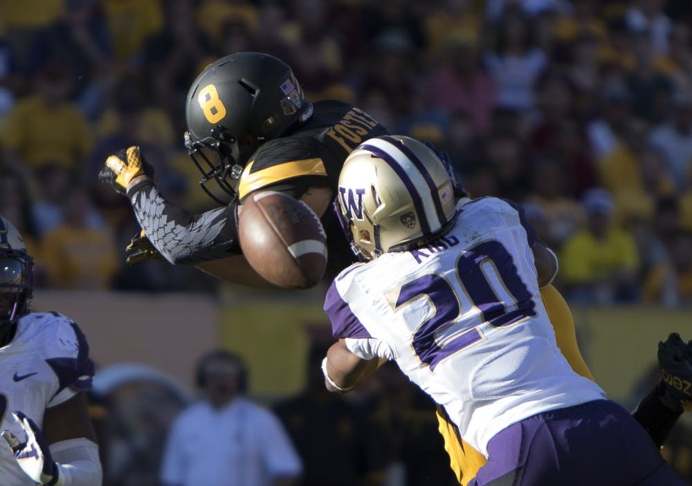 Senior wide receiver D.J. Foster (8) attempts to catch a pass in the fourth quarter against Washington on Saturday, Nov. 14, 2015, at Sun Devil Stadium in Tempe. The Sun Devils defeated the Huskies 27-17. 