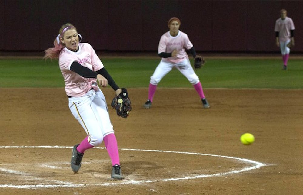 Junior pitcher Mackenzie Popescue launches a pitch against Portland State during a, "Pink Game," on Feb. 23. Popescue and the rest of the ASU softball team have gotten off to incredible 16-0 start. (Photo by Dominic Valente)