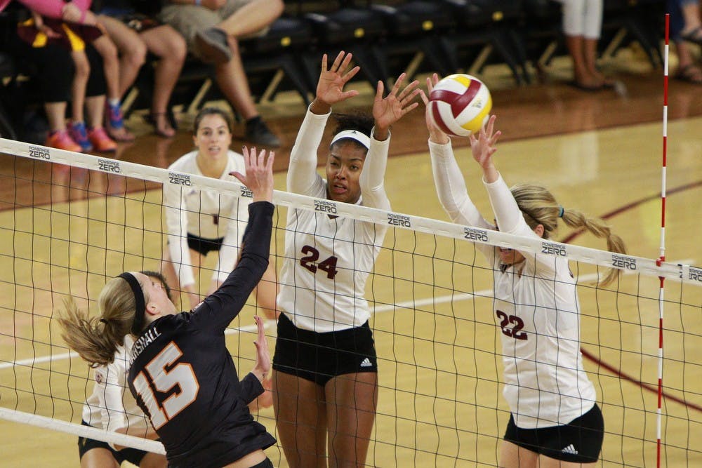 Junior outside hitter Cassidy Pickrell (22) and senior middle blocker Mercedes Binns (24) jump for a block in the second set against Oregon State Sunday, Sept. 27, 2015 at Wells Fargo Arena in Tempe. The Sun Devils defeated the Beavers three games to none to improve to 13-0 on the season (25-18, 25-19, 25-20).