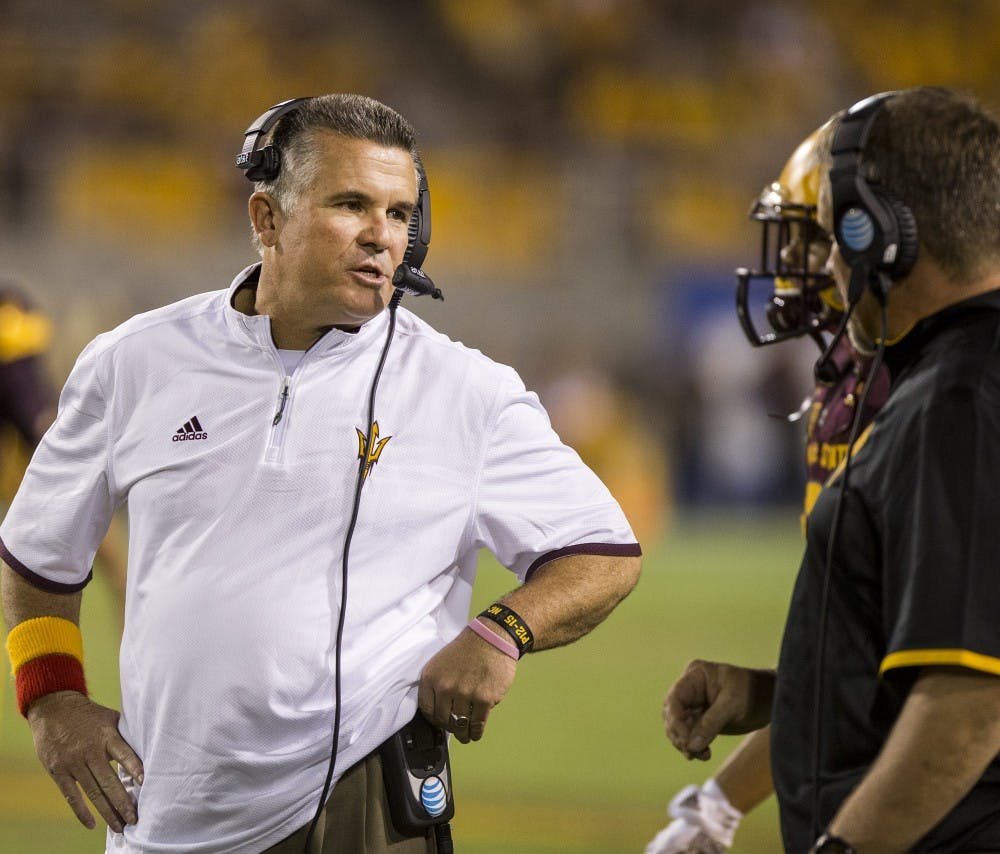 Sun Devil head coach Todd Graham speaks to huddled players during a game against visiting Cal Poly at Sun Devil Stadium in Tempe on Saturday, Sept. 12, 2015. ASU beat Cal Poly 35-21 in their season opener. 