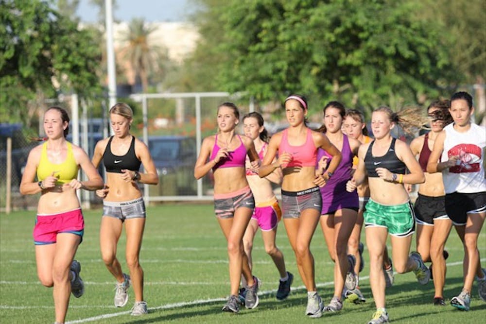 Several runners from the ASU women’s cross-country team pace together as a group during a practice. (Photo by Kyle Newman)