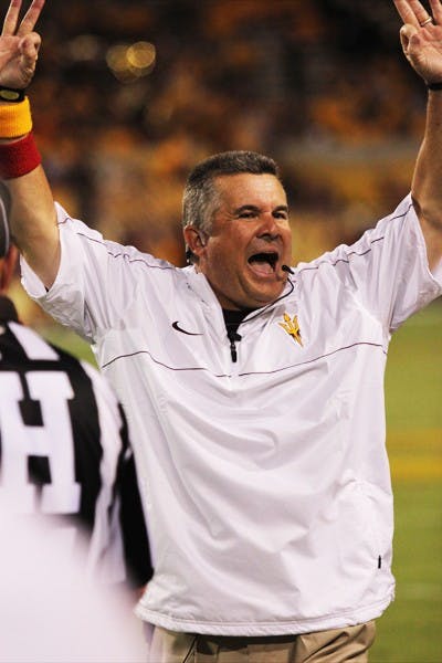 Football coach Todd Graham celebrates from the sideline during ASU’s 63-6 win over NAU on Thursday. (Photo by Kyle Newman)